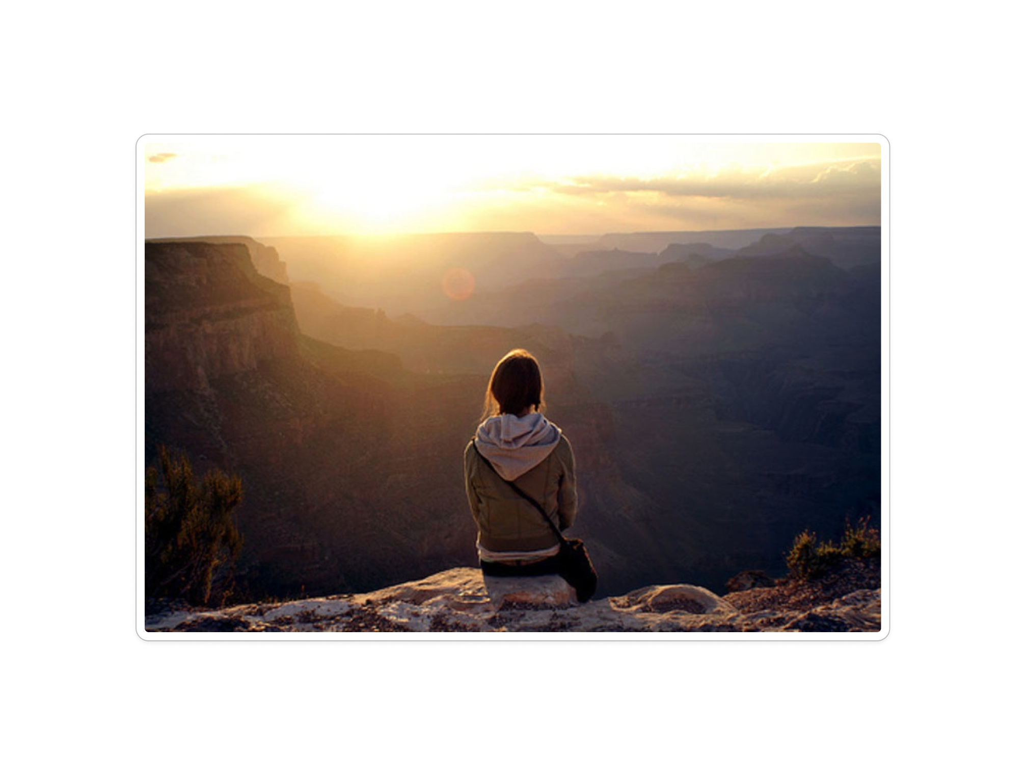Person overlooking mountain landscape